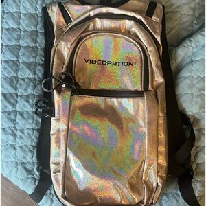 Vibedration iridescent gold hydration backpack! NEVER used, free pack of tips